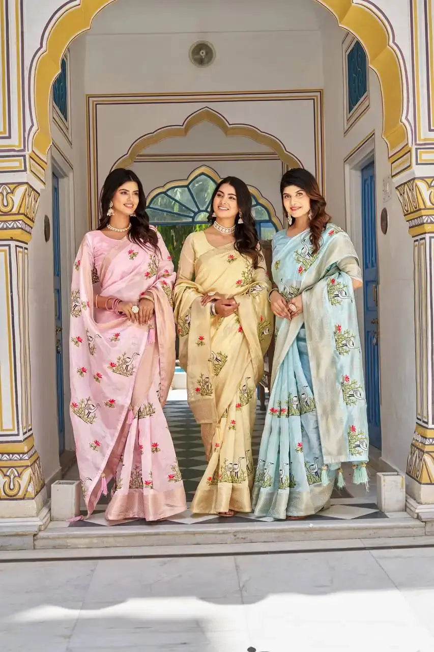 Sky Blue Thread Embroidered Jacquard Saree in a palace archway group shot